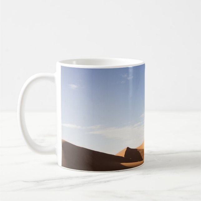 BROWN SAND UNDER BLUE SKY DURING DAYTIME COFFEE MUG (Left)