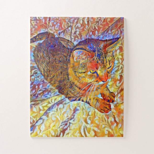 Brown tabby cat resting on a comfy bed jigsaw puzzle (Vertical)