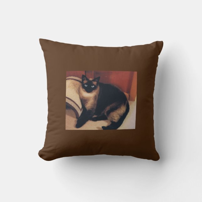 Brown throw pillow with Siamese cat design. (Front)