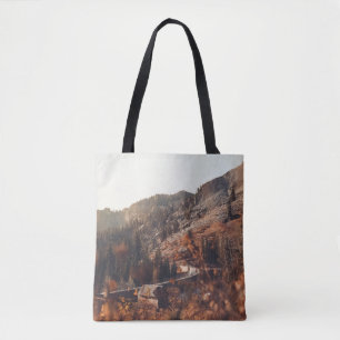 BROWN WOODEN BRIDGE ON BROWN ROCKY MOUNTAIN DURING TOTE BAG