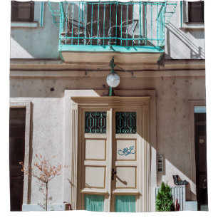 Brown wooden door on white concrete building shower curtain