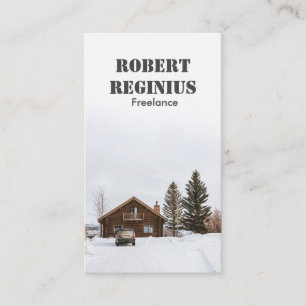 brown wooden house on snow covered ground business card
