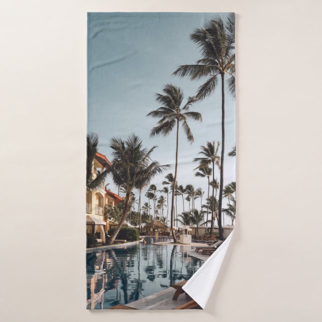 Brown wooden lounge chairs near pool surrounded by bath towel (Bath Towel)