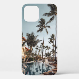 Brown wooden lounge chairs near pool surrounded by iPhone 12 case