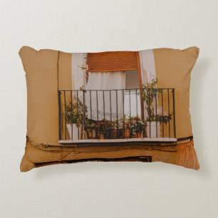 BROWN WOODEN WINDOW FRAME WITH GREEN PLANTS DECORATIVE CUSHION
