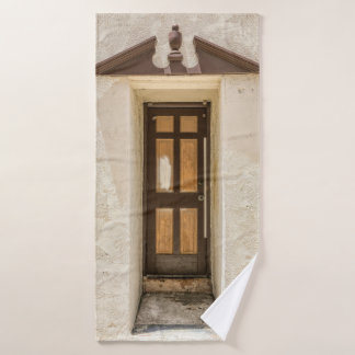 BROWN WOODEN WINDOW ON WHITE CONCRETE WALL BATH TOWEL