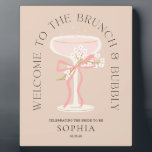 Brunch and Bubbly Champagne Bridal Shower Welcome  Plaque<br><div class="desc">This beautiful sign is the perfect way to welcome your bridal shower guests! When planning a bridal shower, choosing these items with our "Brunch and Bubbly" theme can make the process delightfully effortless while ensuring a stunning result. The modern illustrated vintage champagne glass, adorned with delicate white flowers and a...</div>
