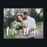 Brush Script Love & Thanks Photo Wedding Thank You Postcard<br><div class="desc">Thank your friends and family for attending your wedding in style with our modern wedding thank you postcard. The postcard displays your favourite horizontal wedding photo with "Love & Thanks" in a white, brush script overlay. Personalise the wedding thank you postcard by adding your names on the front. The postcard...</div>