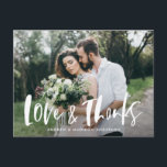 Brush Script Love & Thanks Photo Wedding Thank You Postcard<br><div class="desc">Thank your friends and family for attending your wedding in style with our modern wedding thank you postcard. The postcard displays your favourite horizontal wedding photo with "Love & Thanks" in a white, brush script overlay. Personalise the wedding thank you postcard by adding your names on the front. The postcard...</div>