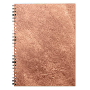 Brushed copper surface, metallic texture. notebook