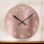 Brushed Metal Rose Gold Pink Glitter Monogram Round Clock<br><div class="desc">Rose Gold - Blush Pink Faux Foil Metallic Sparkle Glitter Brushed Metal Monogram Name Clock. This makes the perfect sweet 16 birthday,  wedding,  bridal shower,  anniversary,  baby shower or bachelorette party gift for someone that loves glam luxury and chic styles.</div>