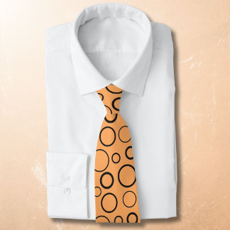 Bubbles and rings, black circles on orange tie