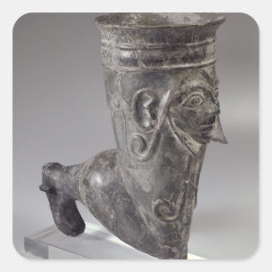 Bucchero vessel in the form of a leg with sculpted square sticker