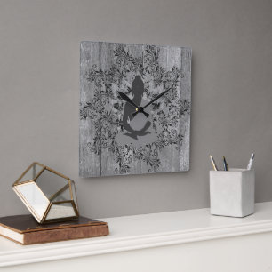 Buddha on Rustic Wood Black Leafy Wreath Square Wall Clock