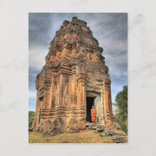 Buddhist monk standing in doorway of temple postcard