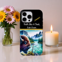 Buffalo by a Calm River in Mountains