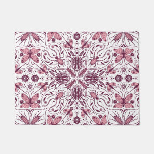 Bugs, dark magenta and pink on white doormat