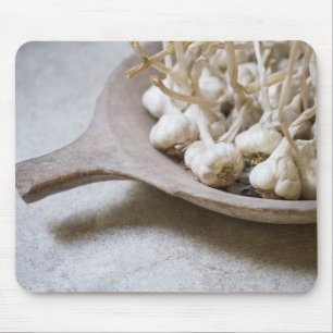 Bulbs of garlic in an earthenware bowl mouse mat