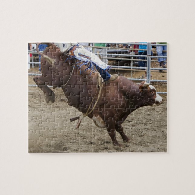 Bull rider at rodeo jigsaw puzzle (Horizontal)