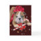 Bulldog puppy with red bow and candy cane