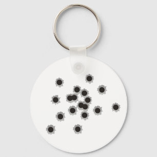 Bullet holes from a rifle or gun, possibly shotgun key ring