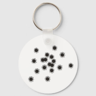 Bullet holes from a rifle or gun, possibly shotgun key ring