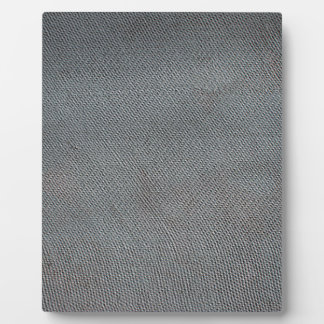 Bumpy surface of a sheet of slate grey plaque