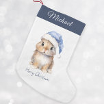 Bunny in Blue Santa's Hat Personalised  Small Christmas Stocking<br><div class="desc">Personalised Christmas Santa Bunny Stocking, perfect for your little ones this holiday season. This adorable stocking features a cute little bunny wearing a blue Santa's hat covered with snow. Stocking can be personalised with your child's name. Hang it on your mantel or in your child's bedroom to add a festive...</div>