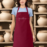 burgundy colour-elegant script  apron<br><div class="desc">Burgundy colour (#800020 ) solid colour all-over print apron with straps of the same colour . It comes with elegant script fonts .Easy to customise it now with your name. Great for any hobby or business . You can add monograms/logo /text etc. Designer's Tip : The name comes in elegant...</div>