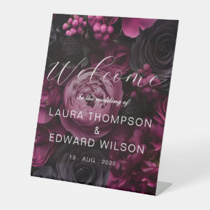 burgundy floral wedding design featuring rich wine pedestal sign