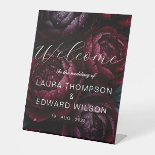 burgundy floral wedding design featuring rich wine pedestal sign