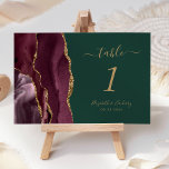 Burgundy Gold Agate Green Wedding Table Number<br><div class="desc">The left-hand edge of this elegant modern wedding table number card features a burgundy watercolor agate border trimmed with faux gold glitter. The customisable text combines gold-coloured handwriting,  and italic and copperplate fonts on an emerald green background.</div>