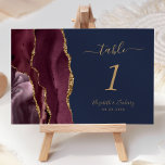 Burgundy Gold Agate Navy Blue Wedding Table Number<br><div class="desc">The left-hand edge of this elegant modern wedding table number card features a burgundy watercolor agate border trimmed with faux gold glitter. The customisable text combines gold-coloured handwriting,  and italic and copperplate fonts on a navy blue background.</div>