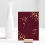 Burgundy Gold Floral Wedding Table Number Card<br><div class="desc">This burgundy gold floral wedding table number card features a gorgeous sophisticated dark merlot backdrop with elegant gold calligraphy and gilded floral embellishments. The jewel-tone colour story and the golden botanical boho accents together with minimal delicate script create a regal and romantic modern aesthetic that strikes a perfect balance between...</div>
