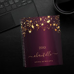 Burgundy gold stars name elegant 2025 planner<br><div class="desc">A dark burgundy background, decorated with faux gold dripping stars. Personalise and add a name and a title. The name is written with a golden modern hand lettered style script with swashes. Perfect for school, work or organising your personal/family life. To keep the swashes only delete the sample name, leave...</div>