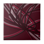Burgundy & Grey Abstract Ribbons Tile<br><div class="desc">Burgundy and grey tile features an artistic abstract ribbon composition with shades of burgundy wine maroon and grey with white accents on a burgundy wine coloured background.</div>