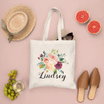 Burgundy Pink Floral Bouquet Bridesmaid Name Tote Bag<br><div class="desc">Custom wedding tote bag features a stylish rustic monogram in script writing with a boho floral bouquet design with beautiful fall watercolor flowers, including roses, dahlias, peony flowers, and greenery, in a gorgeous autumn palette of burgundy red, golden yellow, peach orange, blush pink, and shades of green. Personalise with a...</div>