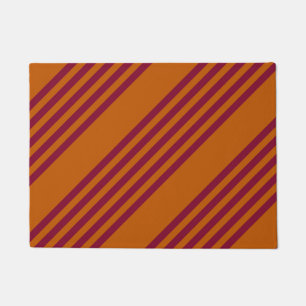 Burgundy red and burnt orange five stripe pattern. doormat
