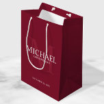 Burgundy Red Personalised Groomsmen Medium Gift Bag<br><div class="desc">Add a personal touch to your wedding with personalised groomsmen gift bag. This gift bag features personalised groomsman's name with title and wedding date in white and monogram in light burgundy red as background, in classic serif font style, on burgundy red background. Also perfect for best man, father of the...</div>