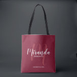 Burgundy Red Script Personalised Bridesmaids Tote Bag<br><div class="desc">Add a personal touch to your wedding with personalised bridesmaids gift tote bag. This tote bag features personalised bridesmaid's name in white modern script font style and monogram in light red modern script font style as background with title and wedding date in white modern sans serif font style on burgundy...</div>