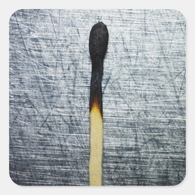 Burned match on stainless steel square sticker (Front)