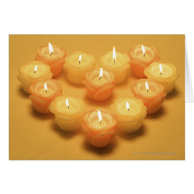 Burning candles arranged in a heart shape (Front Horizontal)
