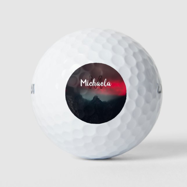 Burning clouds, fog and mountains monogram in sky golf balls (Front)