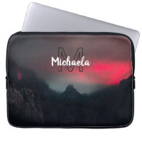 Burning clouds, fog and mountains monogram in sky