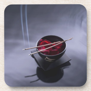 Burning incense on top of bowl of petals coaster