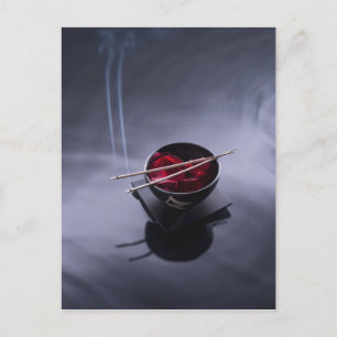Burning incense on top of bowl of petals postcard