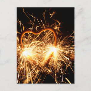 Burning sparkler in form of a heart postcard