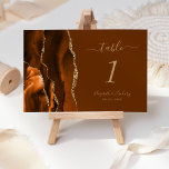 Burnt Orange Gold  Brown Agate Wedding Table Number<br><div class="desc">The left-hand edge of this elegant modern wedding table number card features a burnt orange watercolor agate border trimmed with faux gold glitter. The customisable text combines gold coloured handwriting,  and italic and copperplate fonts on a rich nutmeg brown background.</div>