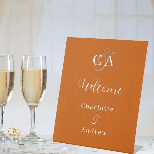 Burnt orange monogram modern wedding welcome pedestal sign