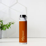 Burnt orange yellow custom name script water bottle<br><div class="desc">Burnt orange as background.  Personalise and add your name.   Yellow coloured handwritten style script.</div>